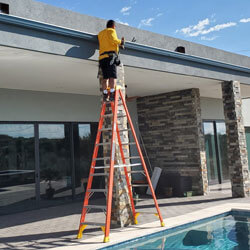 Man Working On Gutters